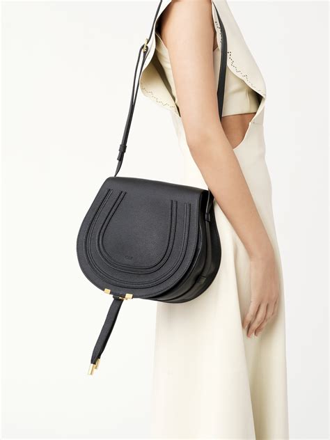 Marcie saddle bag grained leather .